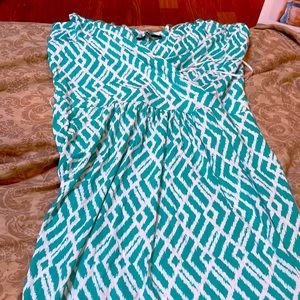 A beautiful bluish green and white dress. That is a size small and it’s a maxi.